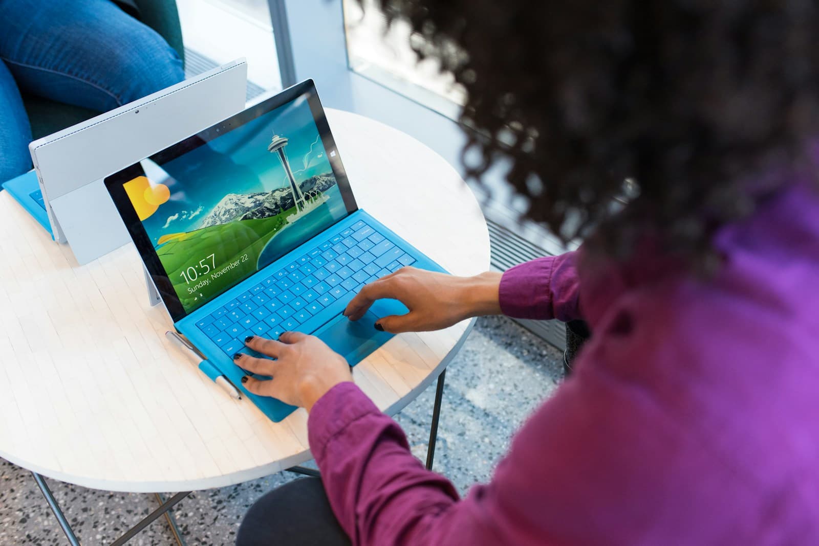 Engineers reviewing code and data on screens together